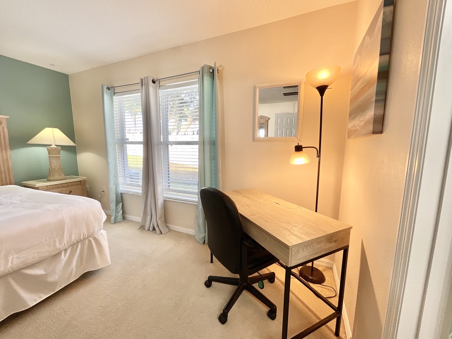 Bedroom 1 with king bed, Smart TV, and ensuite with desk