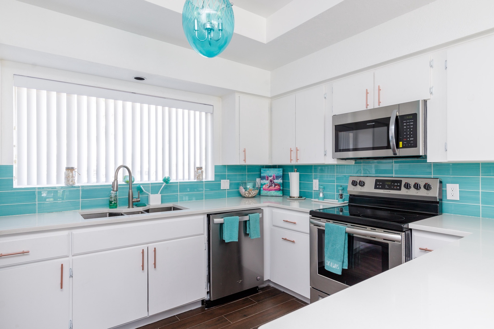 The beachy kitchen offers ample storage space & all the comforts of home