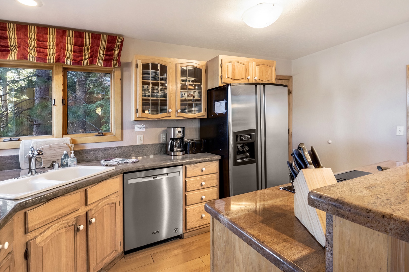 The kitchen offers ample storage space & all the comforts of home