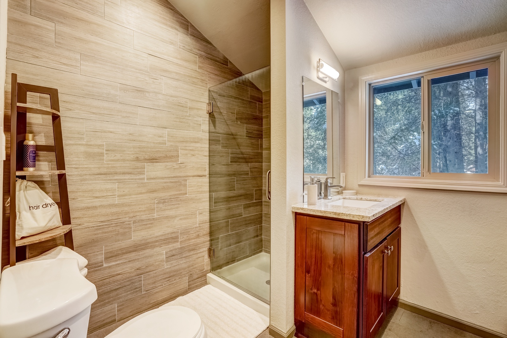 The king en suite bathroom offers a single vanity & glass shower