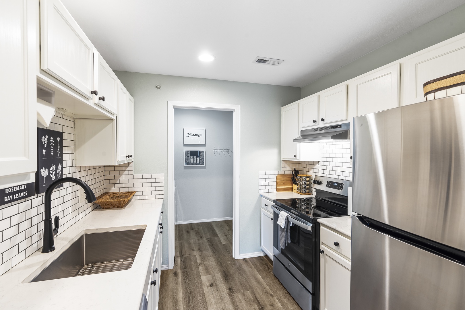 The chic, updated kitchen is spacious & offers all the comforts of home