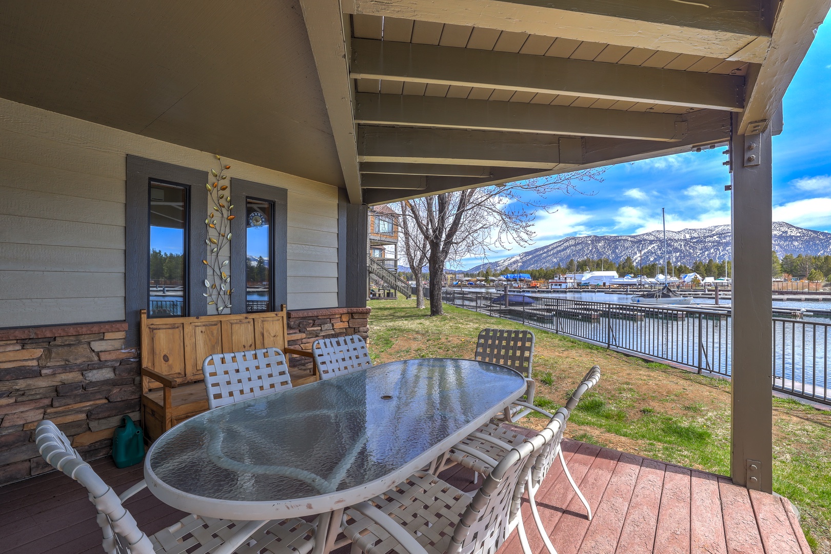 Relax on the covered deck with panoramic views of the picturesque Tahoe Keys