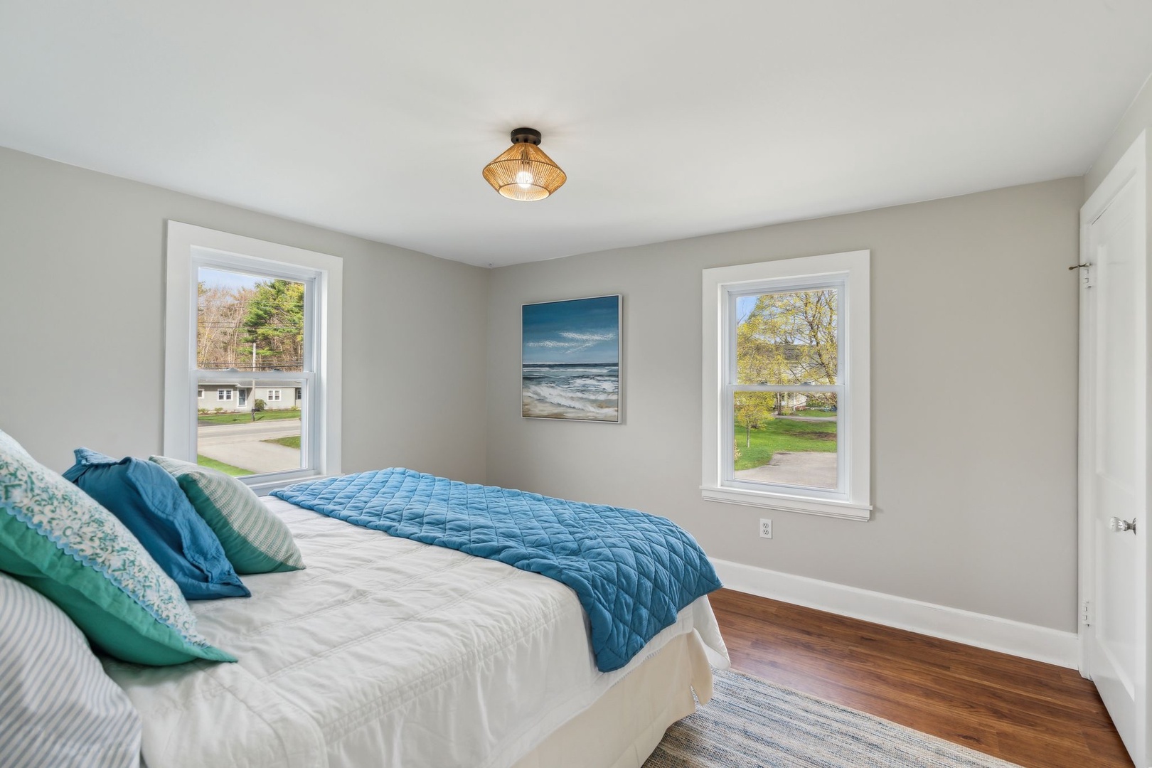 This airy bedroom features a luxurious king-size bed