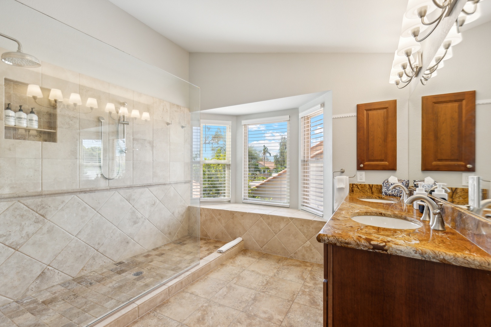 Ensuite bathroom with dual sinks, and walk-in shower with dual shower heads