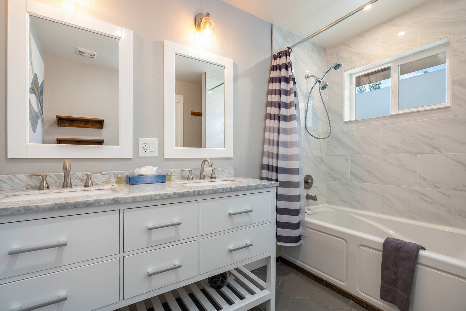 Master bathroom with double vanity and bathtub/shower combo