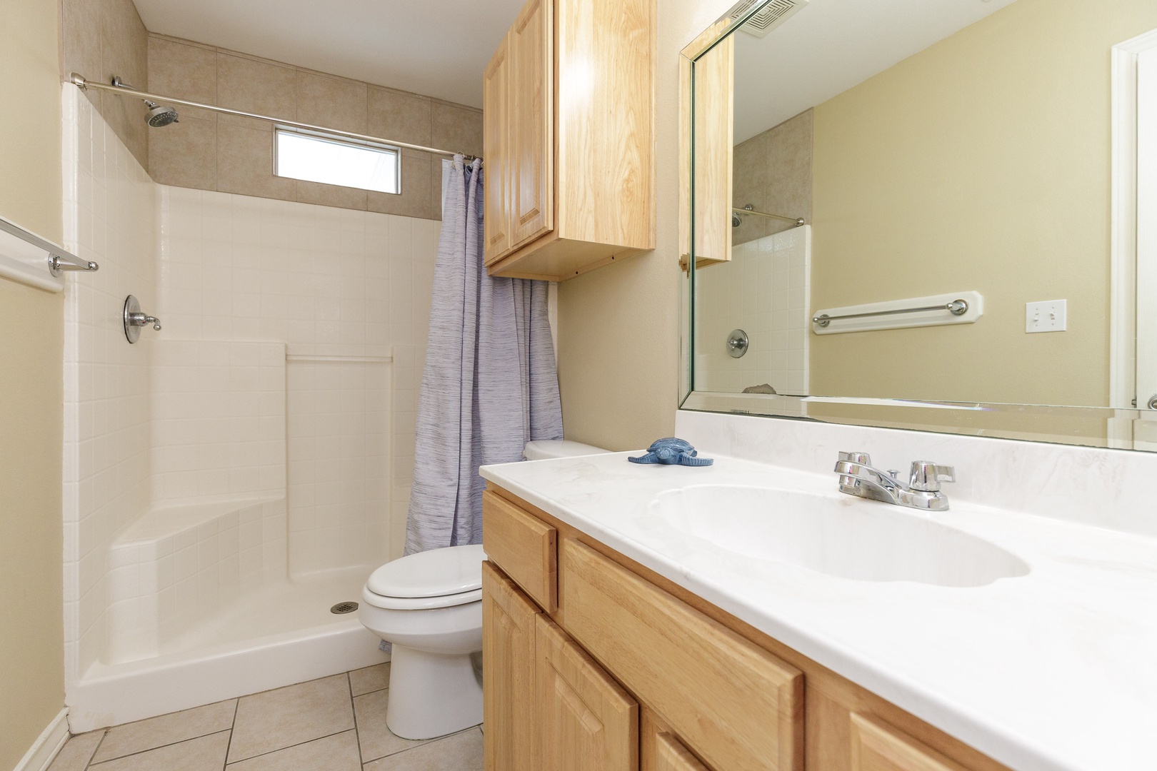 This ensuite bathroom offers an oversized vanity & walk-in shower