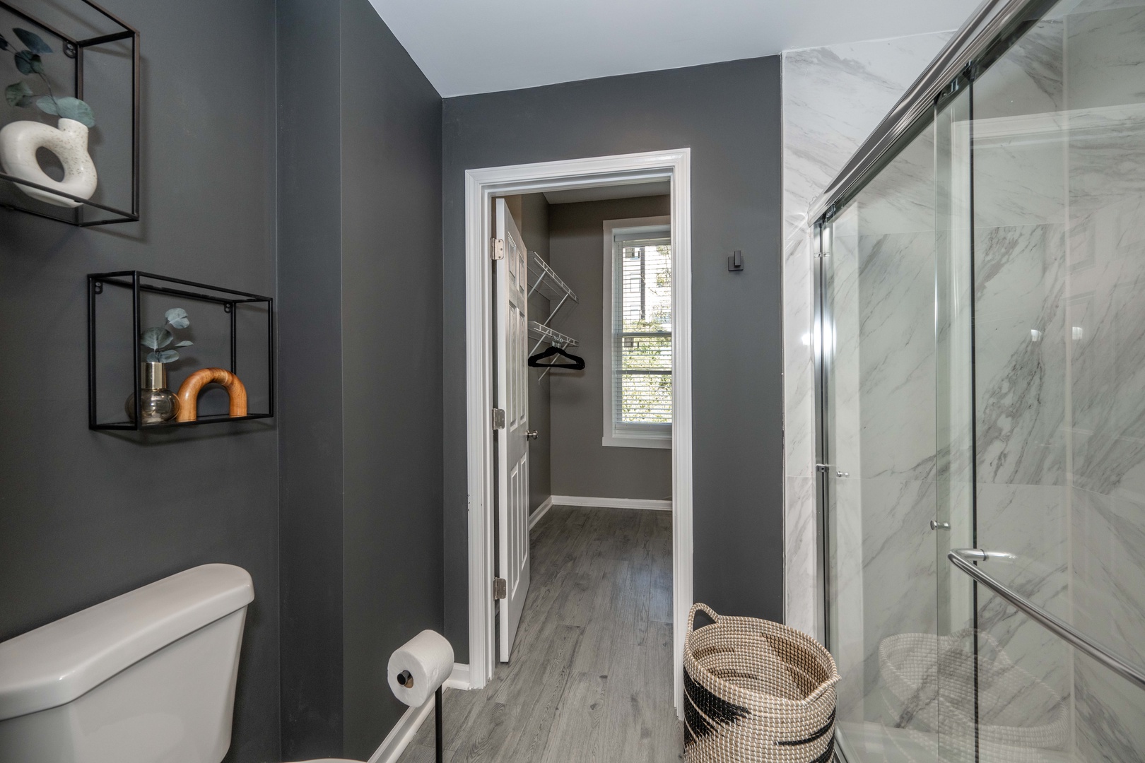 Wash up in the ensuite bath, featuring a double vanity & glass shower