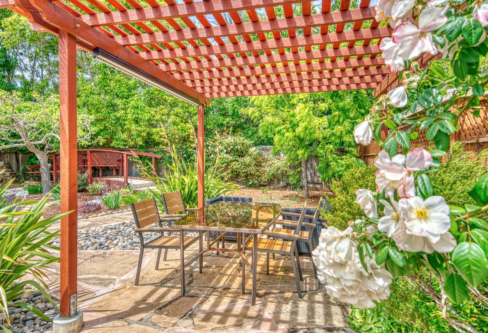 Lounge the day away or enjoy a stroll in the tranquil backyard oasis