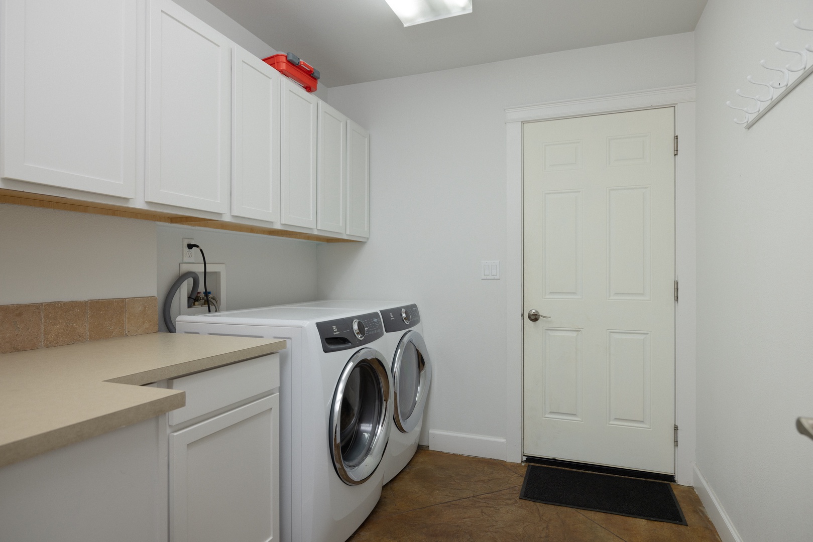 Private laundry is available for your stay, tucked away in the laundry room