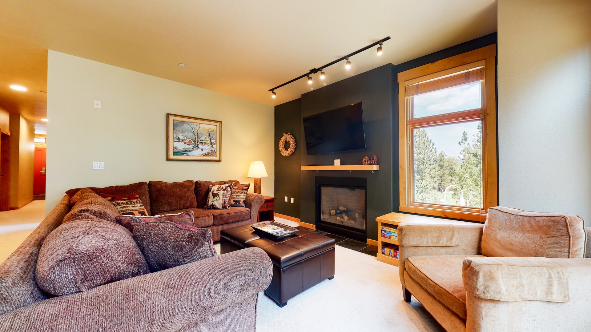 Living room with sofa sleeper, Smart TV, gas fireplace