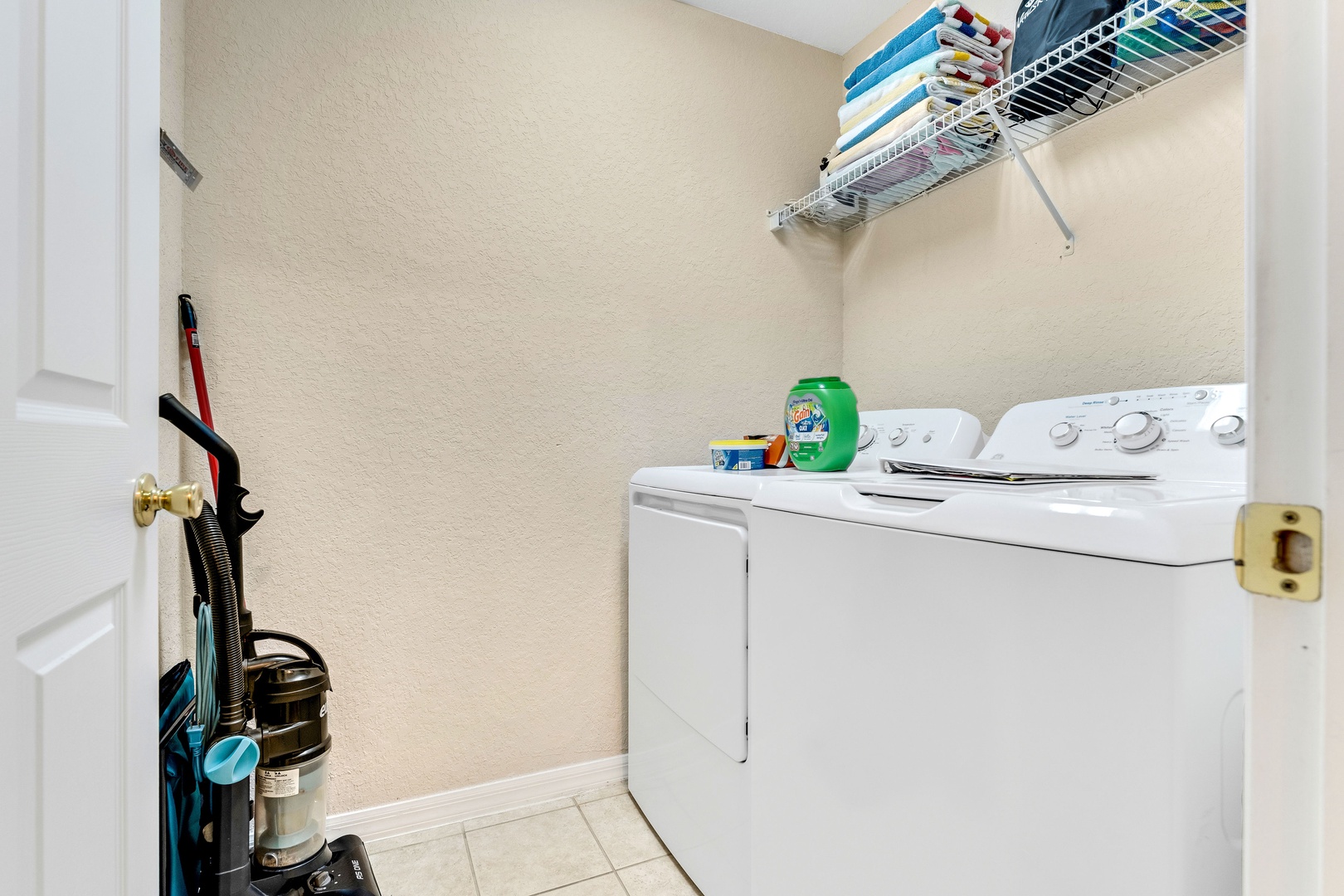 Private laundry is available for your stay, tucked away near the entry
