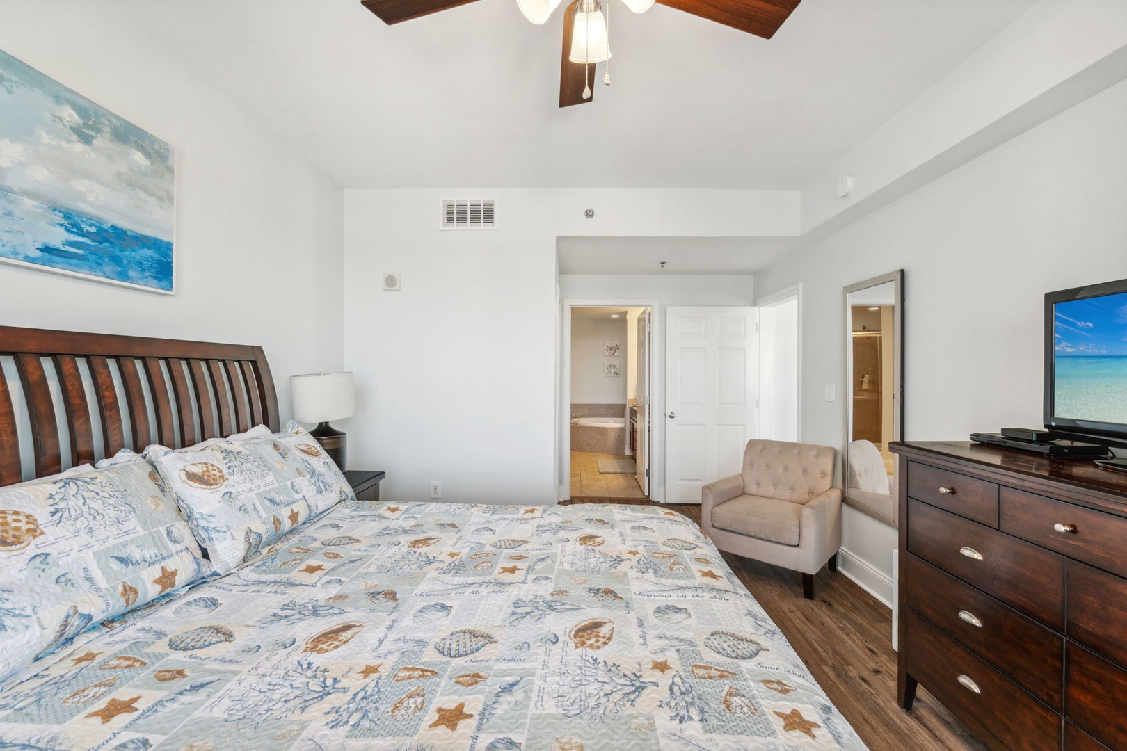Bedroom 1 with king bed, Smart TV, balcony, and en-suite