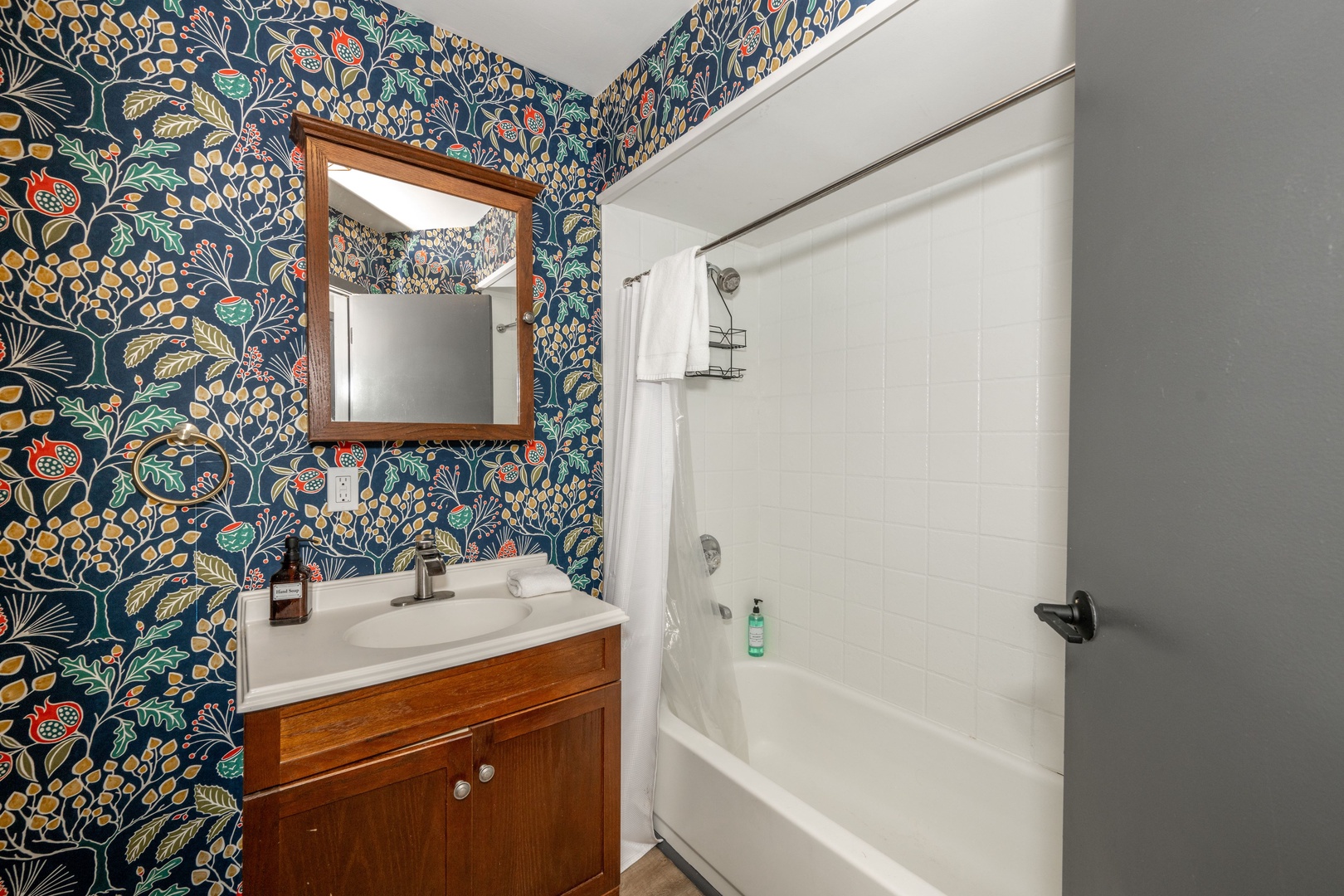 The final full bath on the lower level offers a single vanity & shower/tub combo