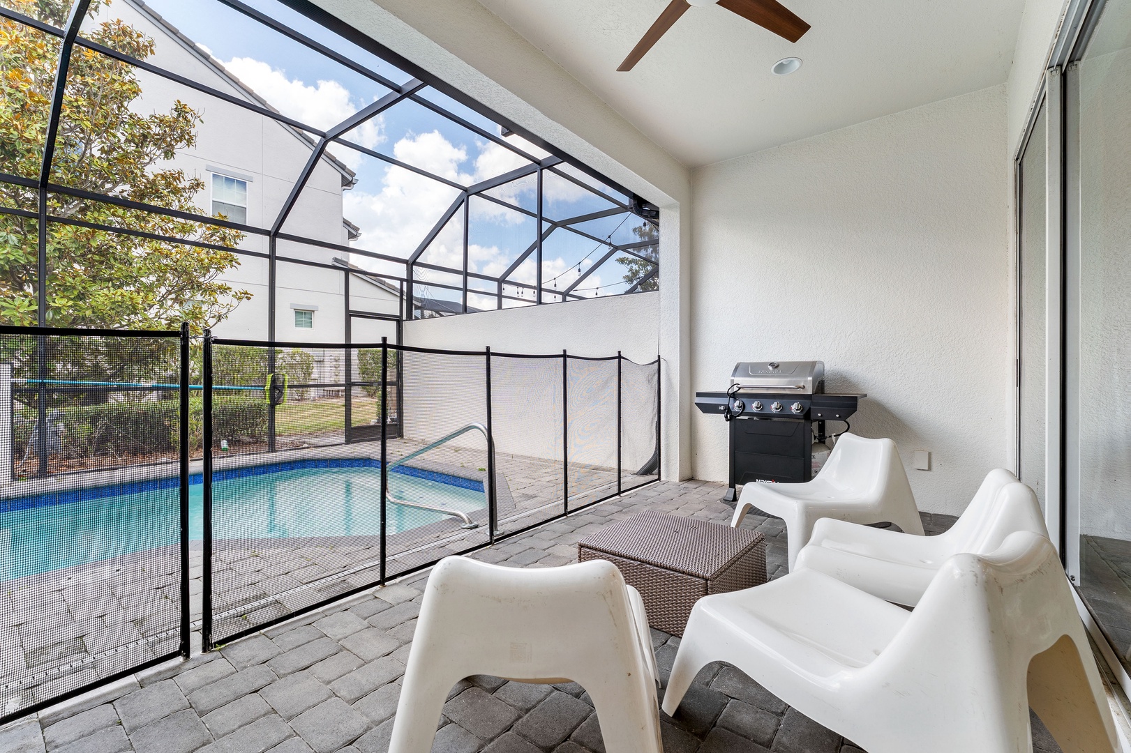 Private screened in pool with outdoor seating