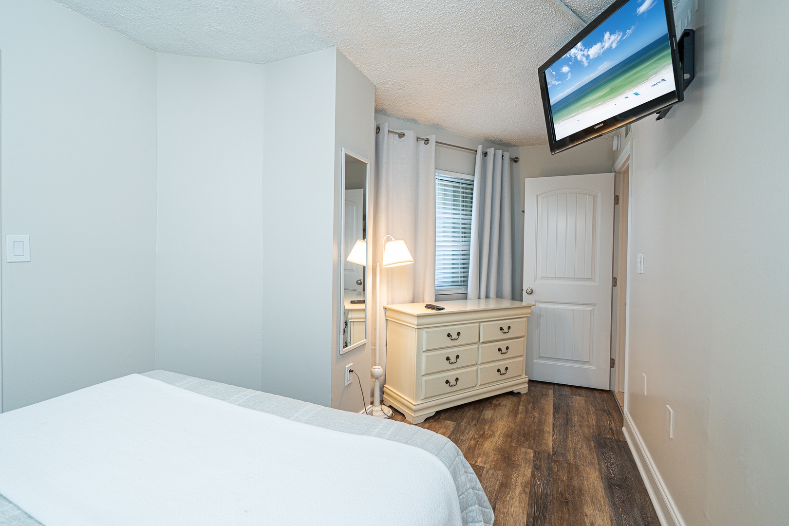 Bedroom 1 with queen bed, and Smart TV