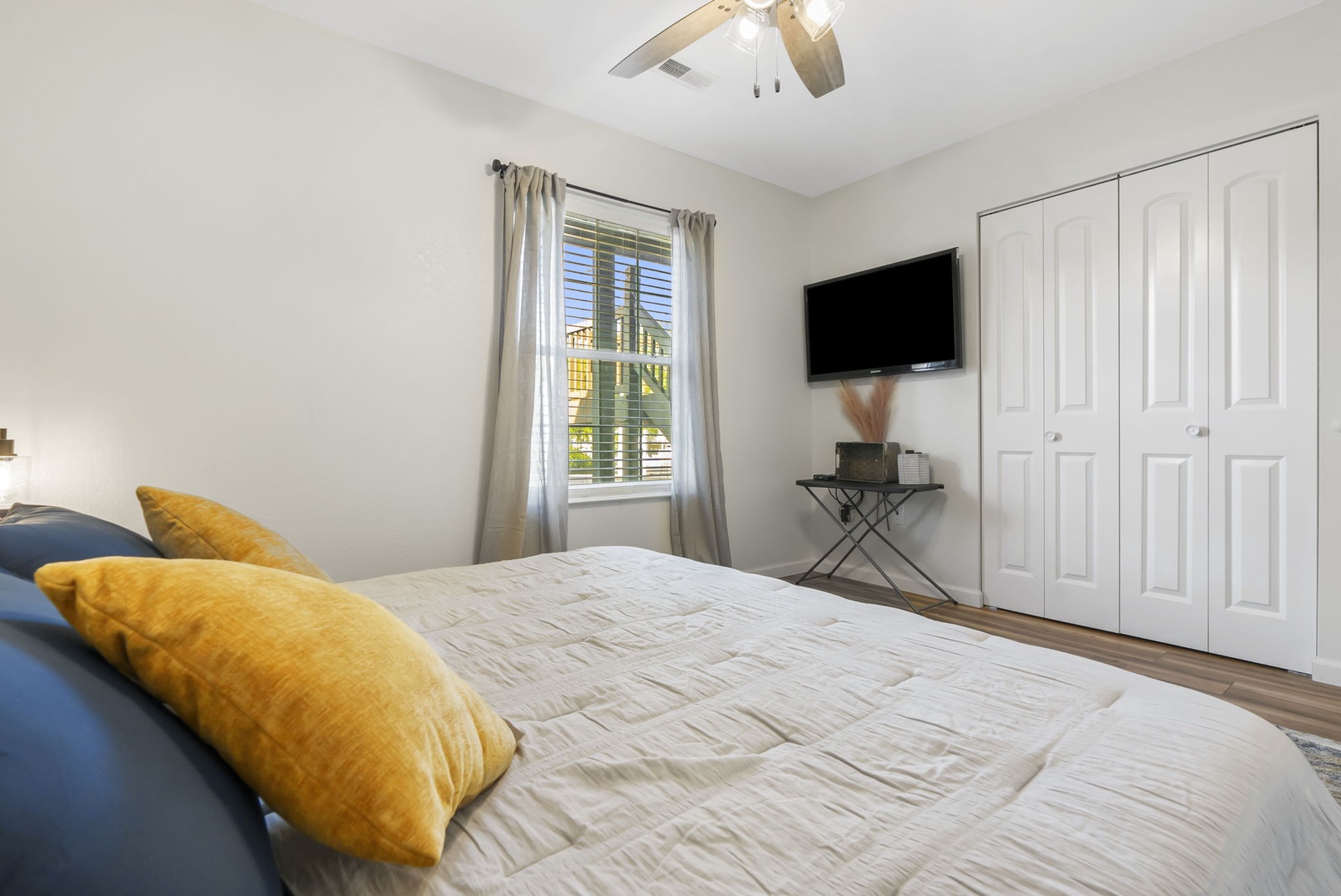 The spacious King Bedroom offers a tranquil retreat spot with its own TV