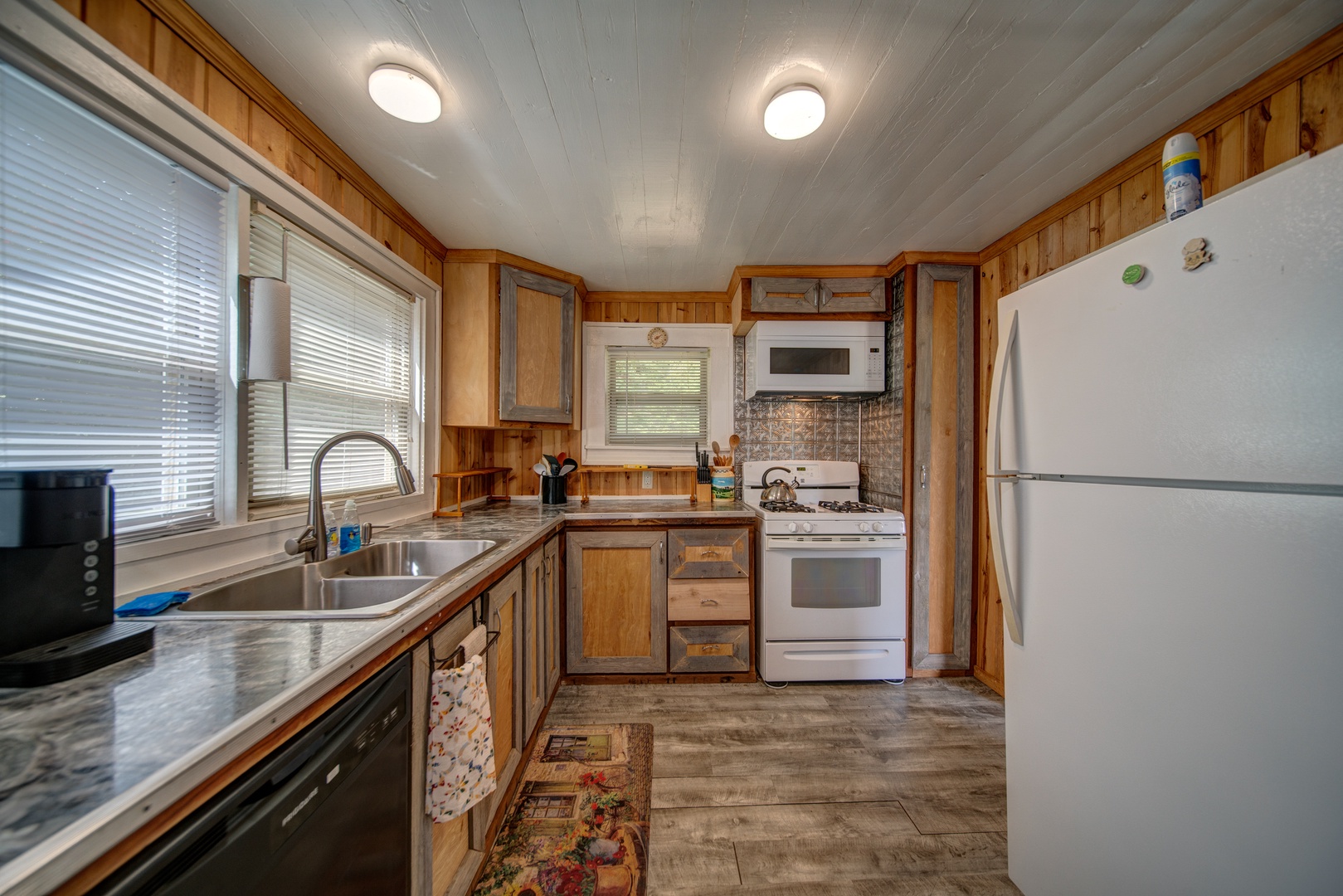 The fully stocked kitchen offers ample space & all the comforts of home