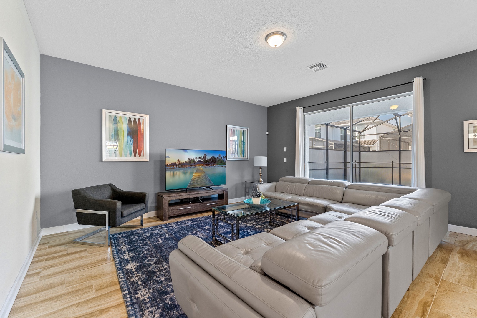 Living area with leather seating and Smart TV