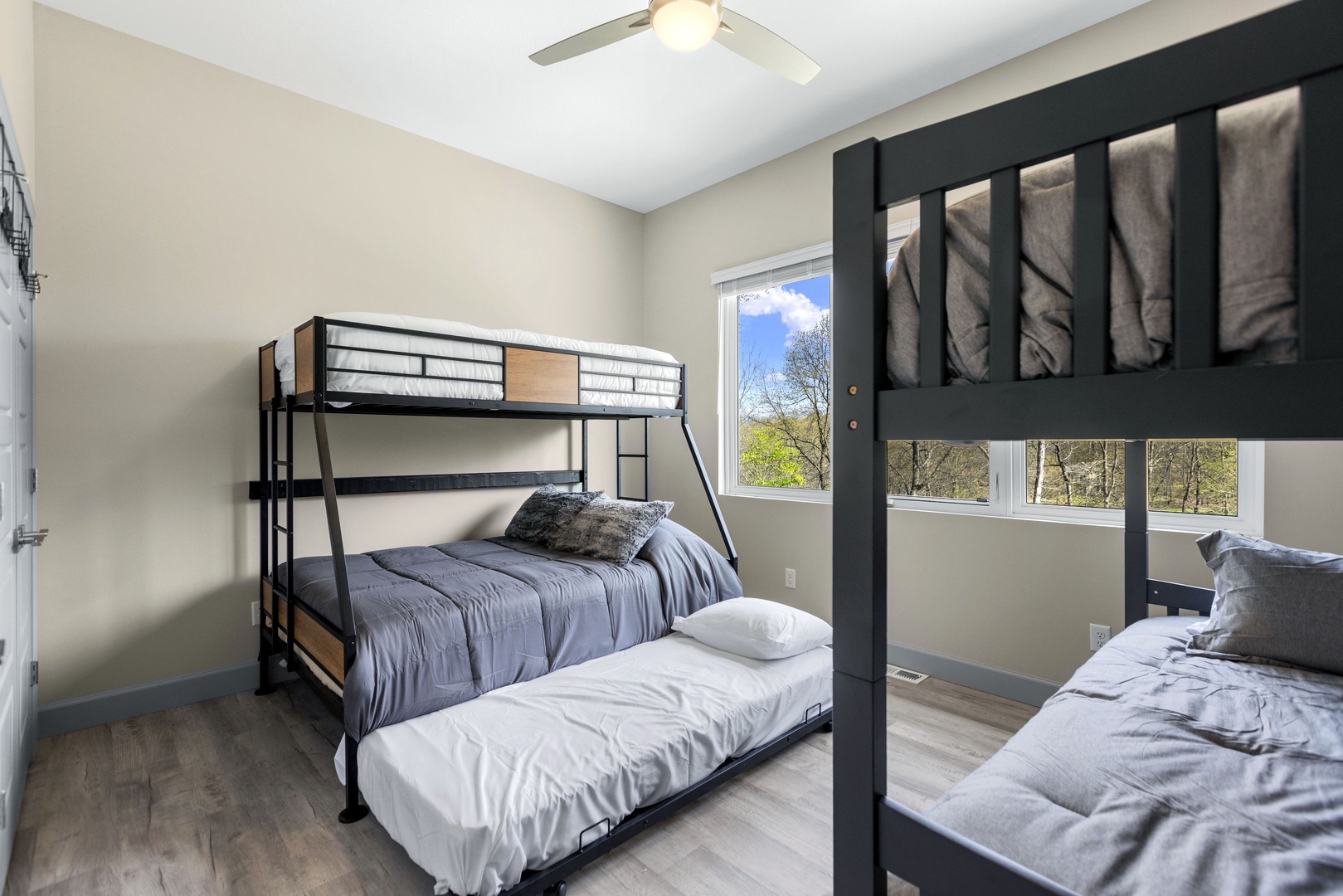 The fourth bedroom features 2 bunk beds and twin trundle