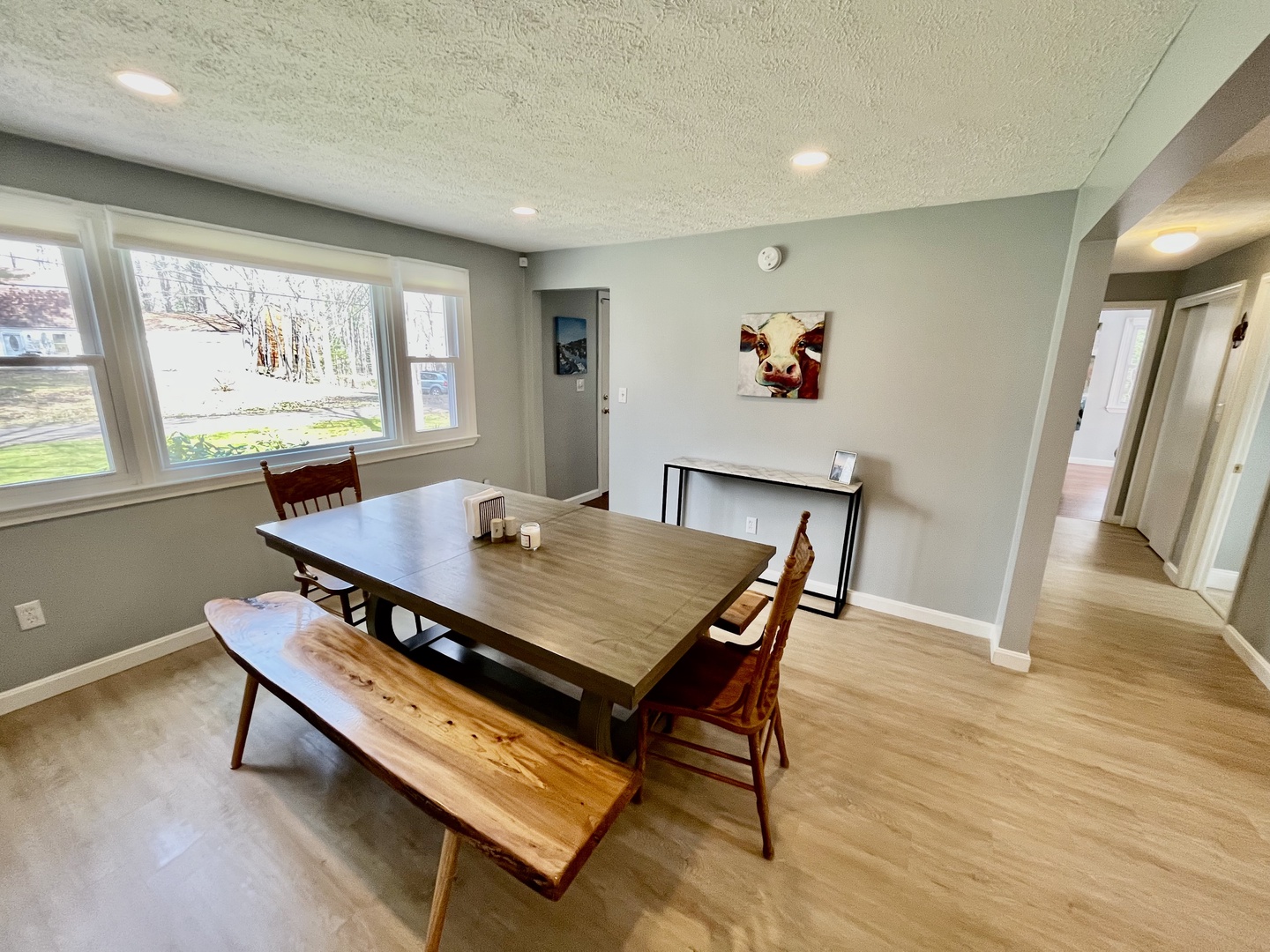 Bright dining area table and seating for up to 8