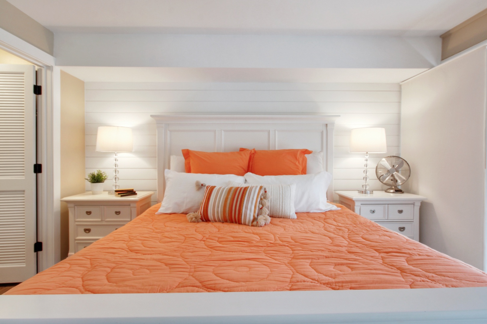 This bedroom sanctuary features a luxurious king-sized bed and deck access.