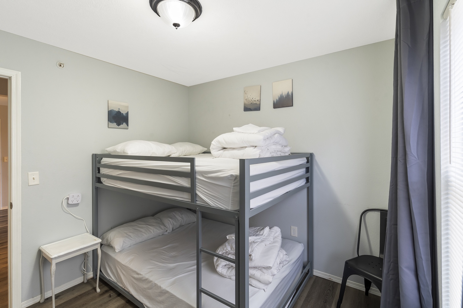 Relax in the second bedroom, which includes a full over full bunk bed