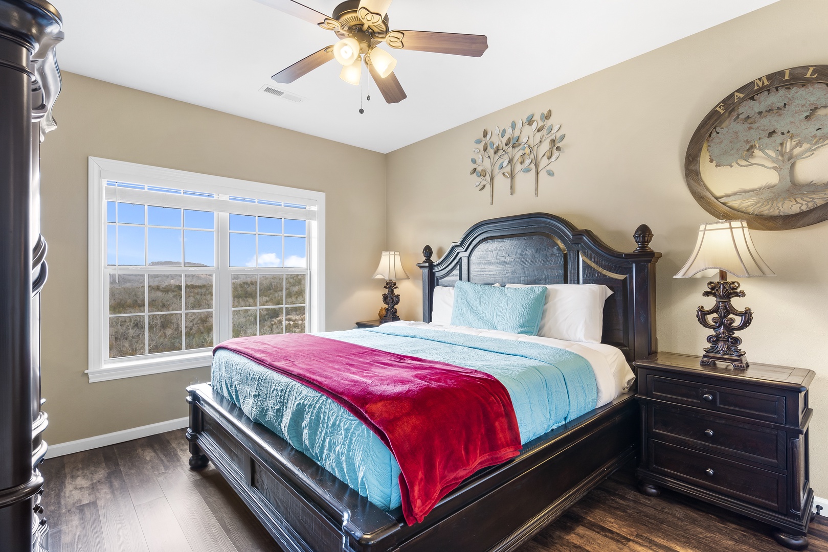 The master suite showcases a regal king bed, private ensuite, & TV