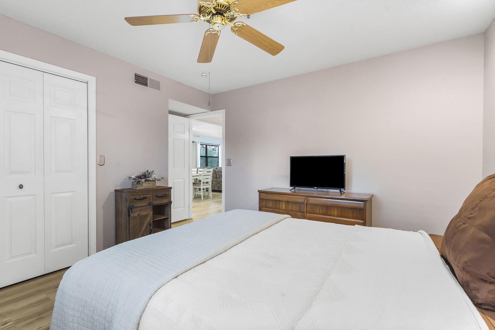 The spacious queen bedroom offers a Smart TV & ceiling fan