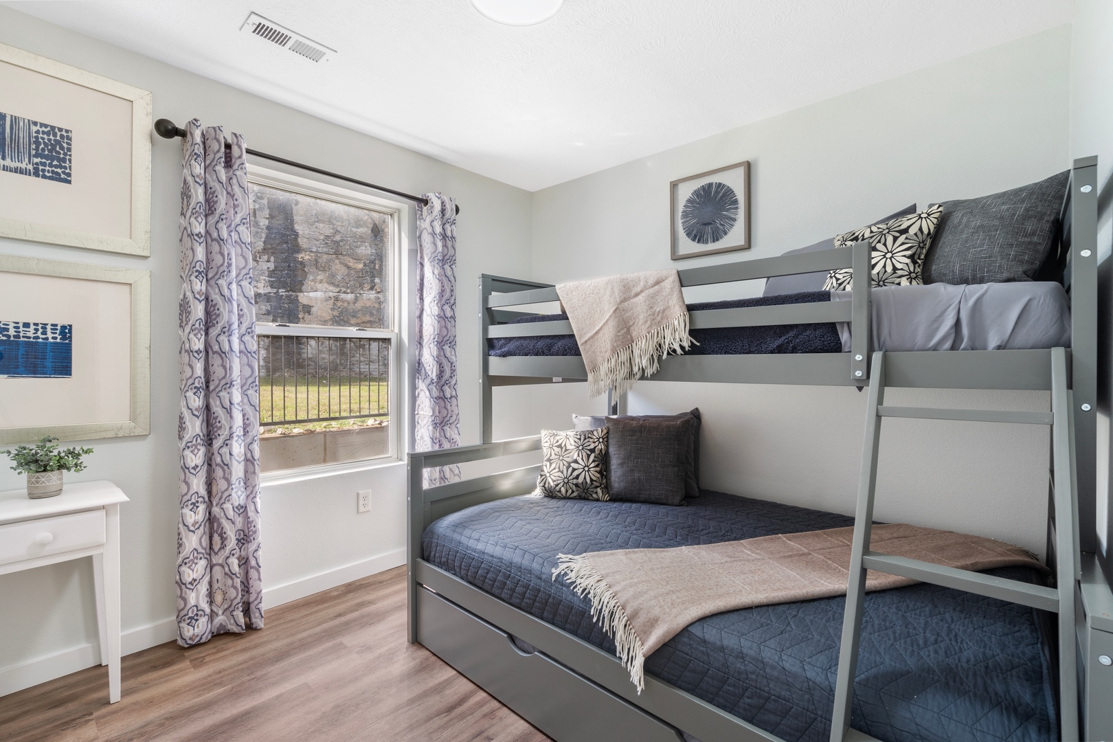 The second bedroom features a cozy twin-over-full bunkbed