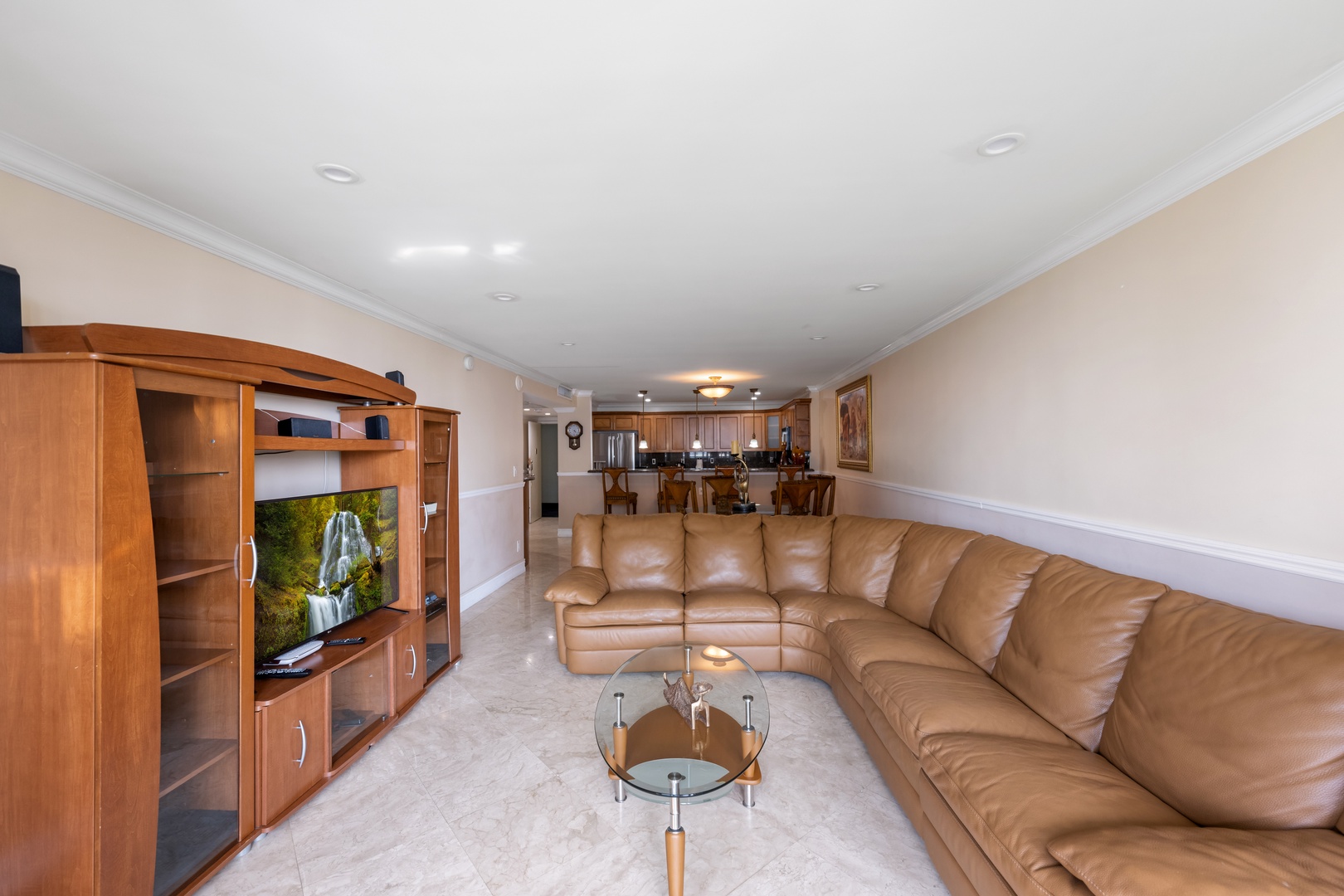 Relax in the spacious living space with a sectional sofa and TV