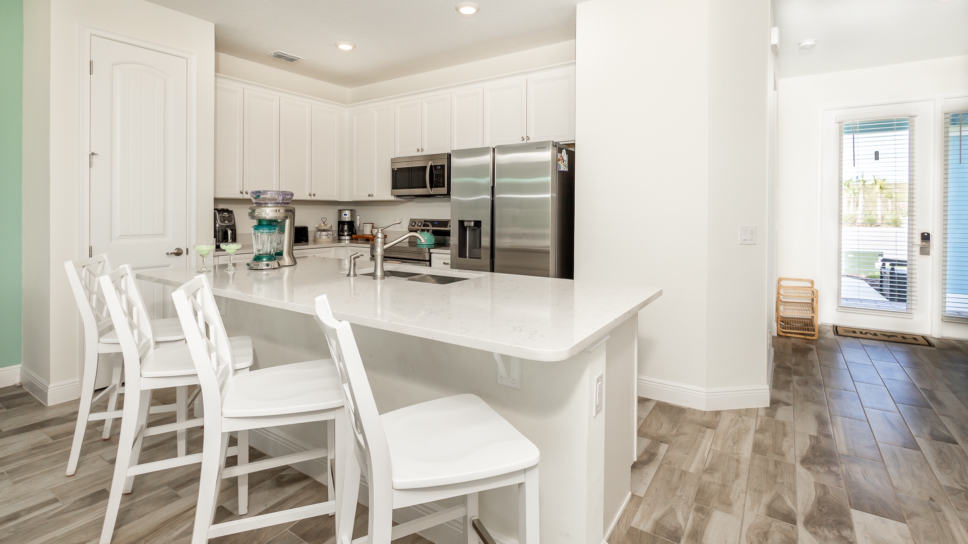 Sip morning coffee or enjoy a snack at the kitchen counter, with seating for 4