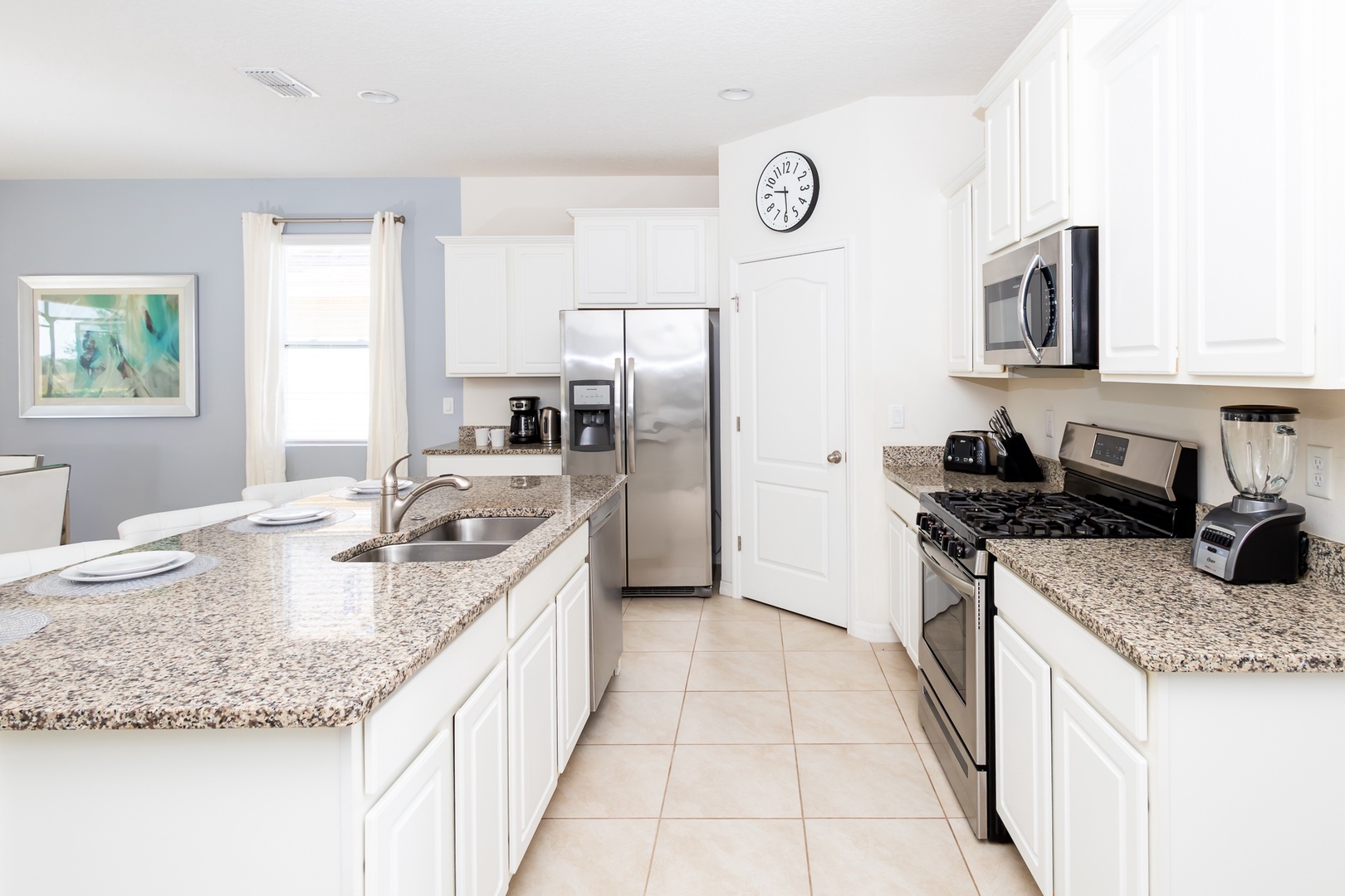 The kitchen offers ample storage space & all the comforts of home