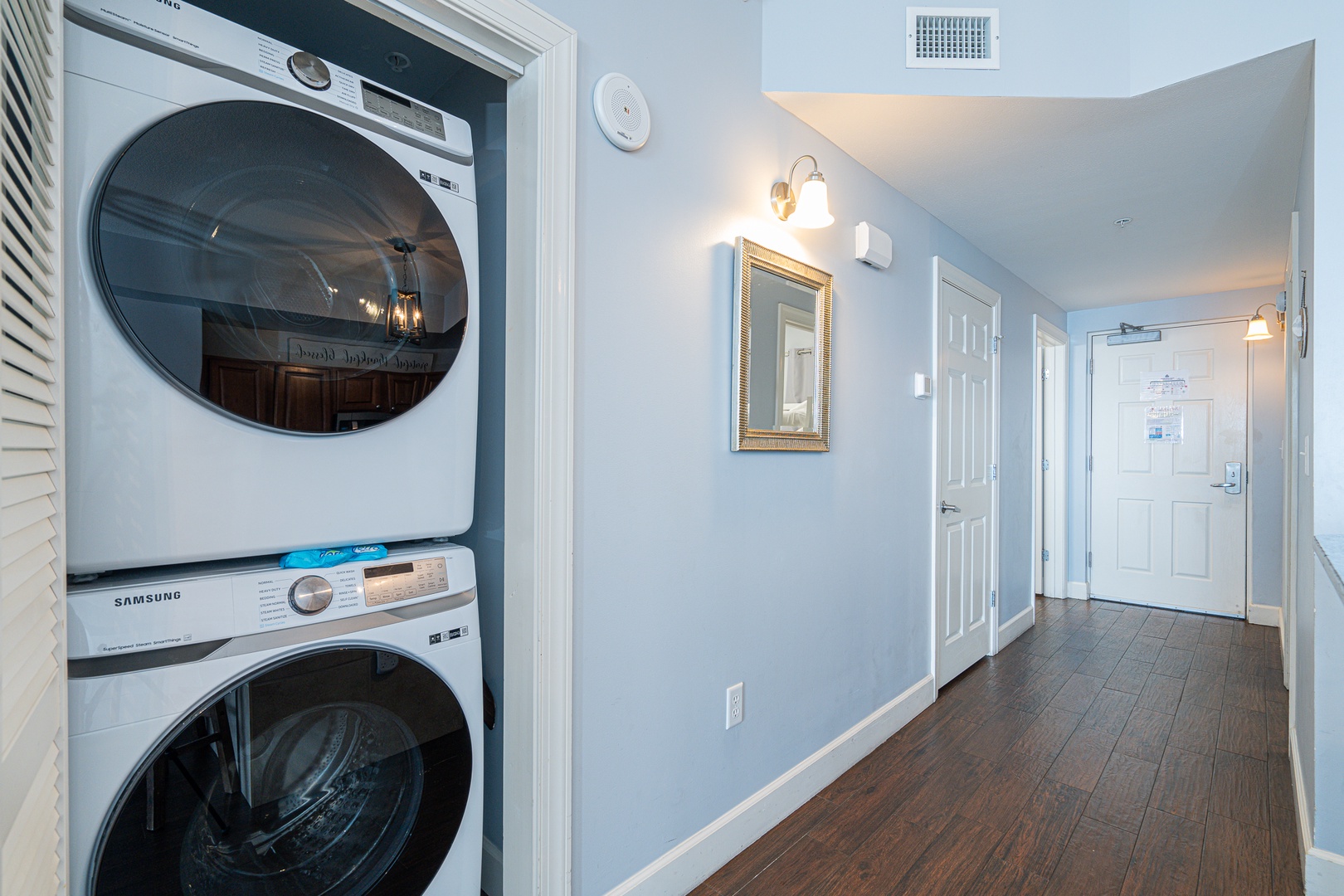 Private laundry is available for your stay, tucked away by the kitchen area
