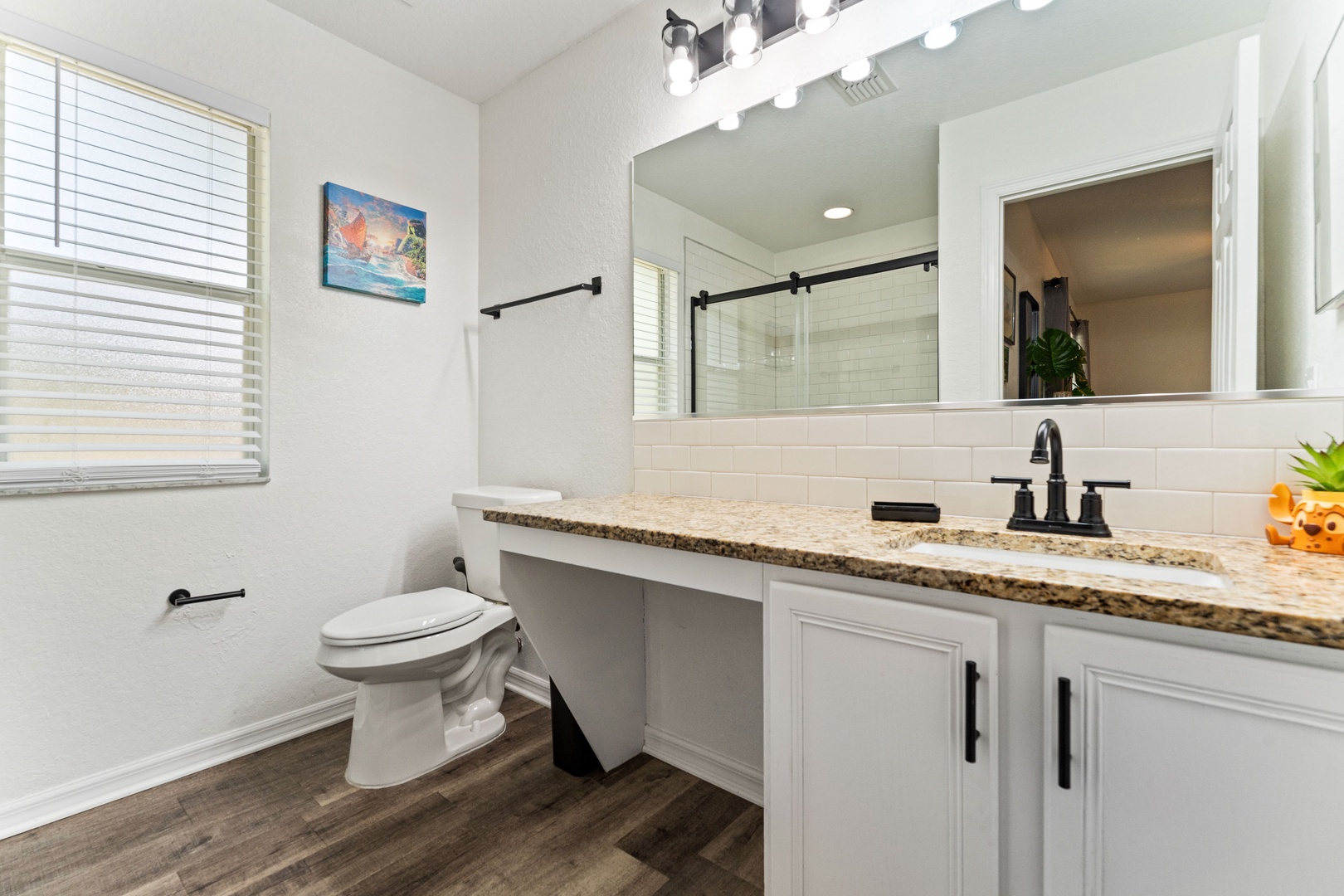 The final ensuite showcases a large single vanity & glass shower