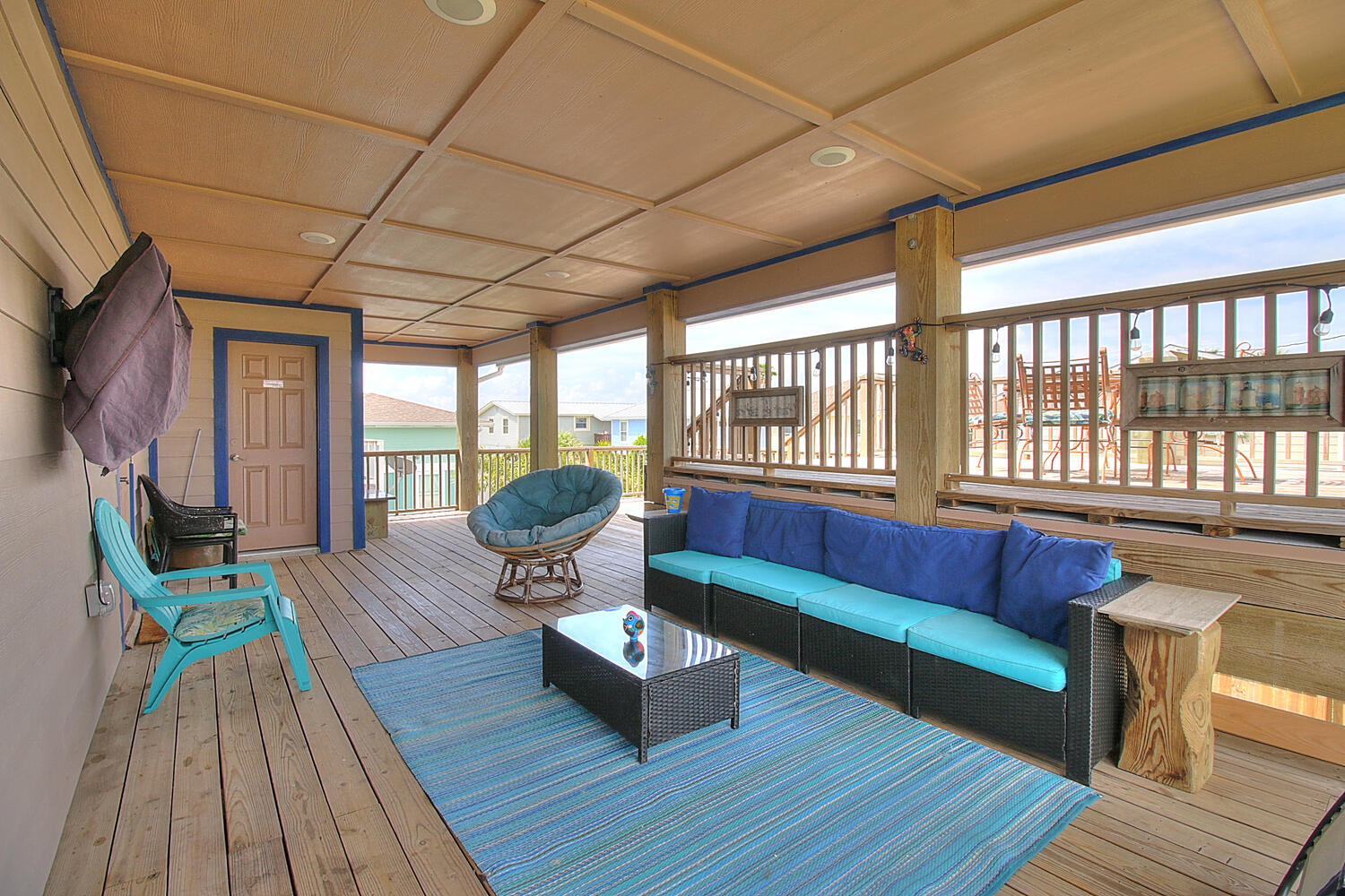 Covered deck with outdoor seating, and TV
