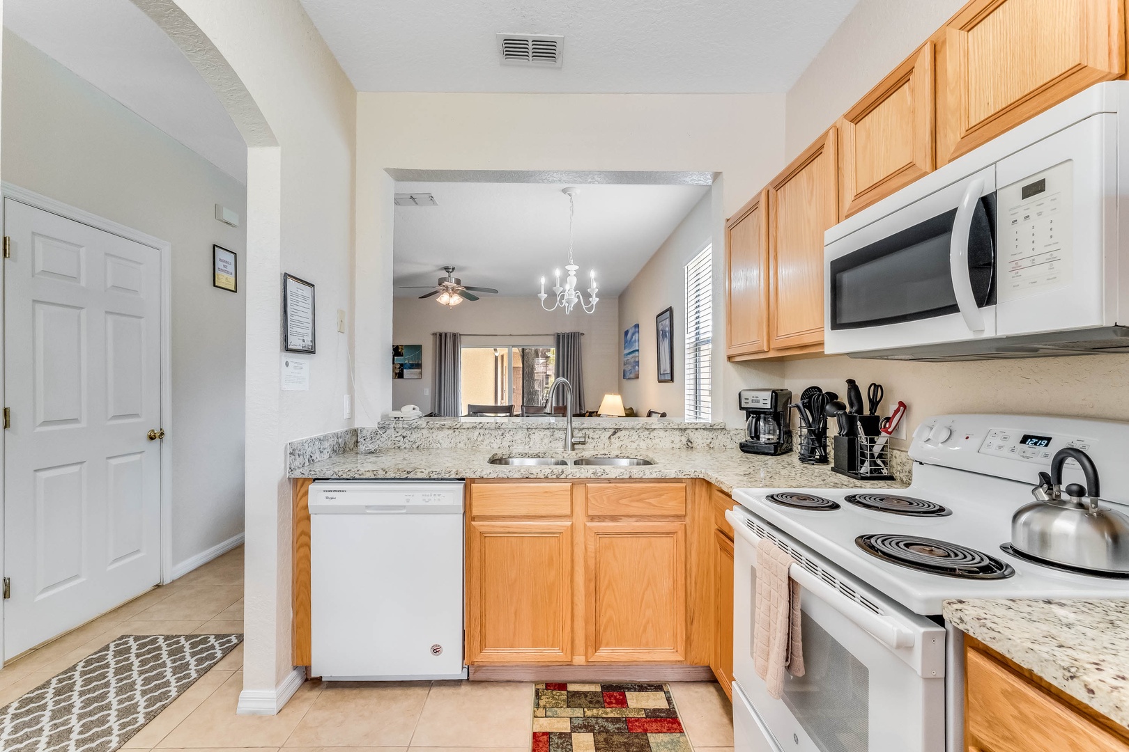 The streamlined kitchen offers ample storage space and wonderful amenities