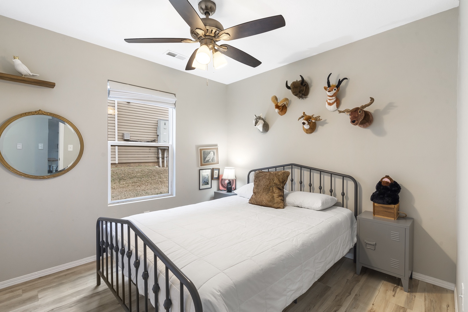Heed the call of the wild in the second bedroom, offering a plush queen bed