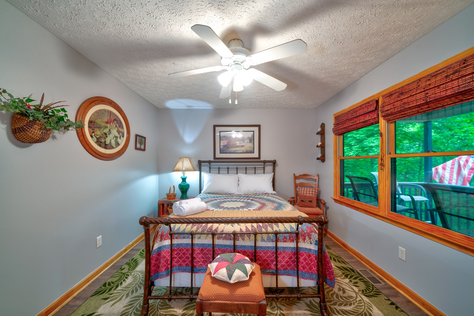 This serene main-level bedroom includes a plush queen-sized bed