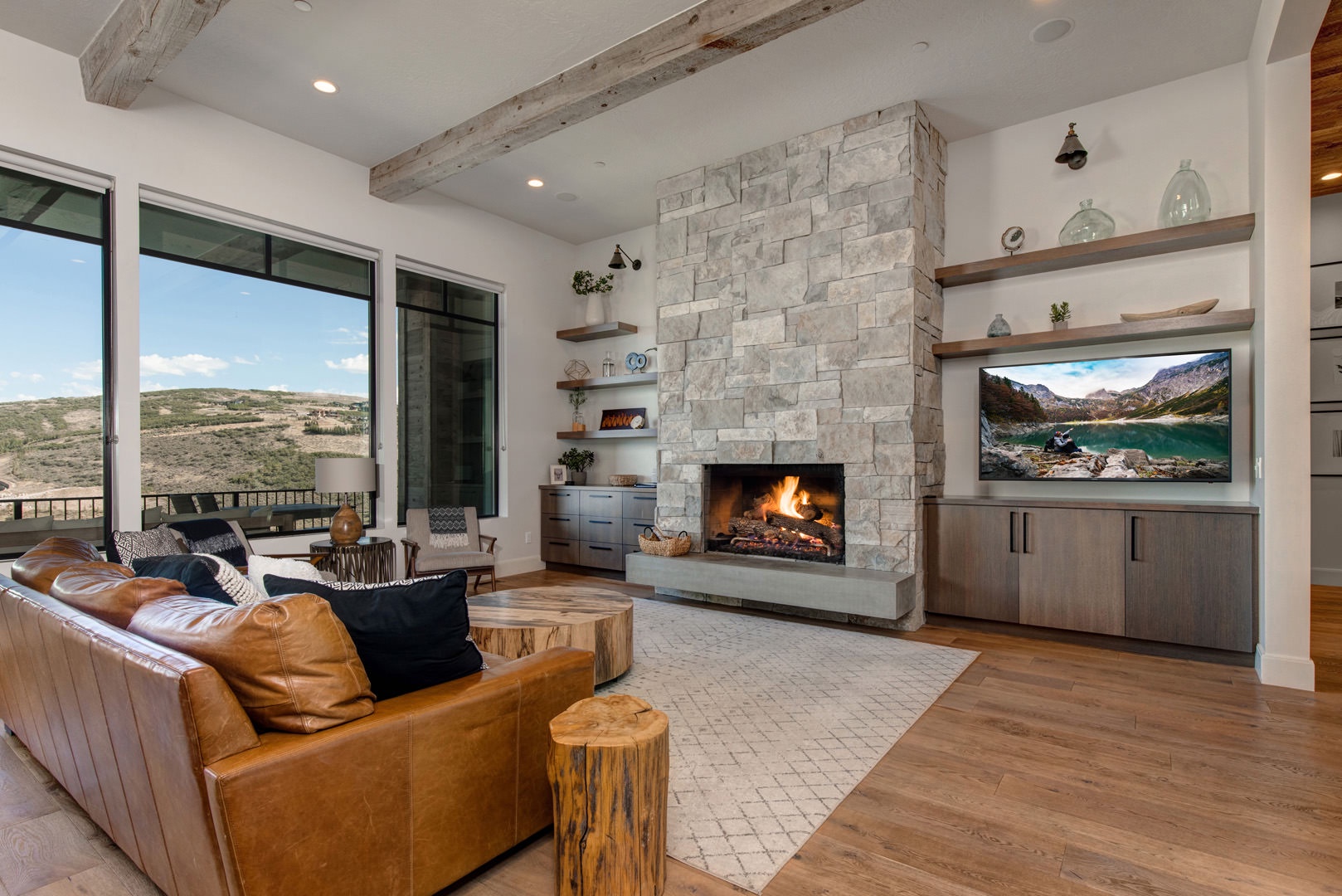 Cozy and spacious living area with TV and fireplace