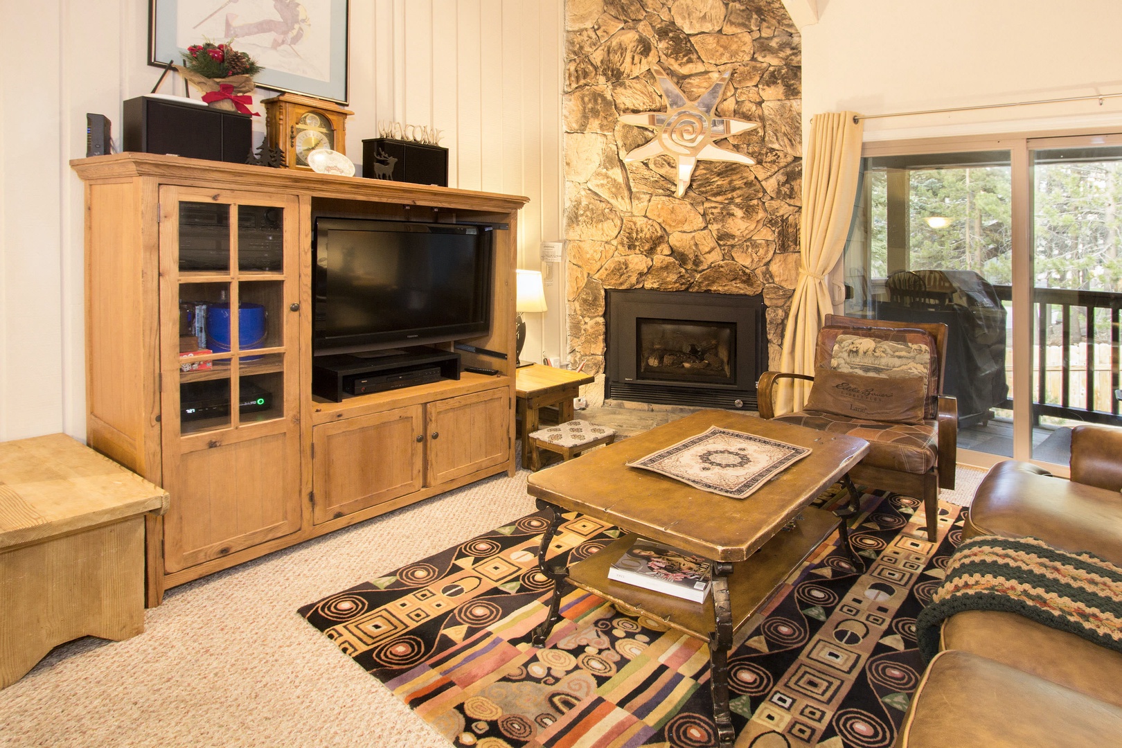 Cozy living room with 42" flat screen TV, DVD player, gas fireplace