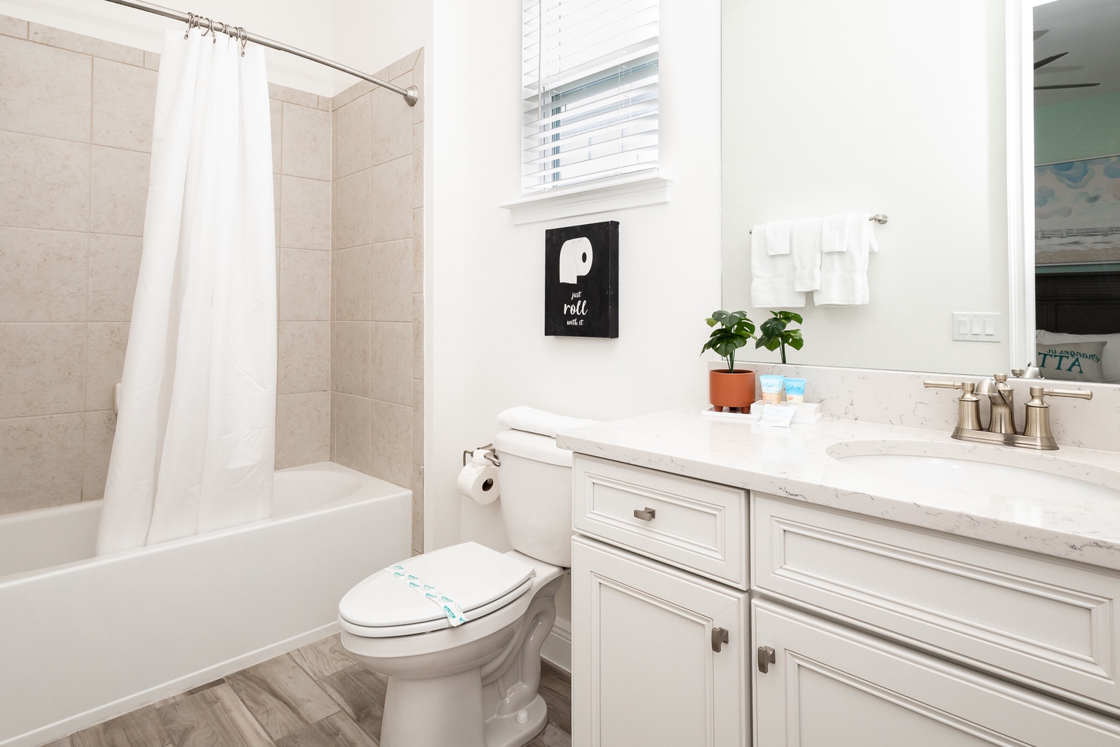 The 2nd floor queen en suite offers a stylish single vanity & shower/tub combo