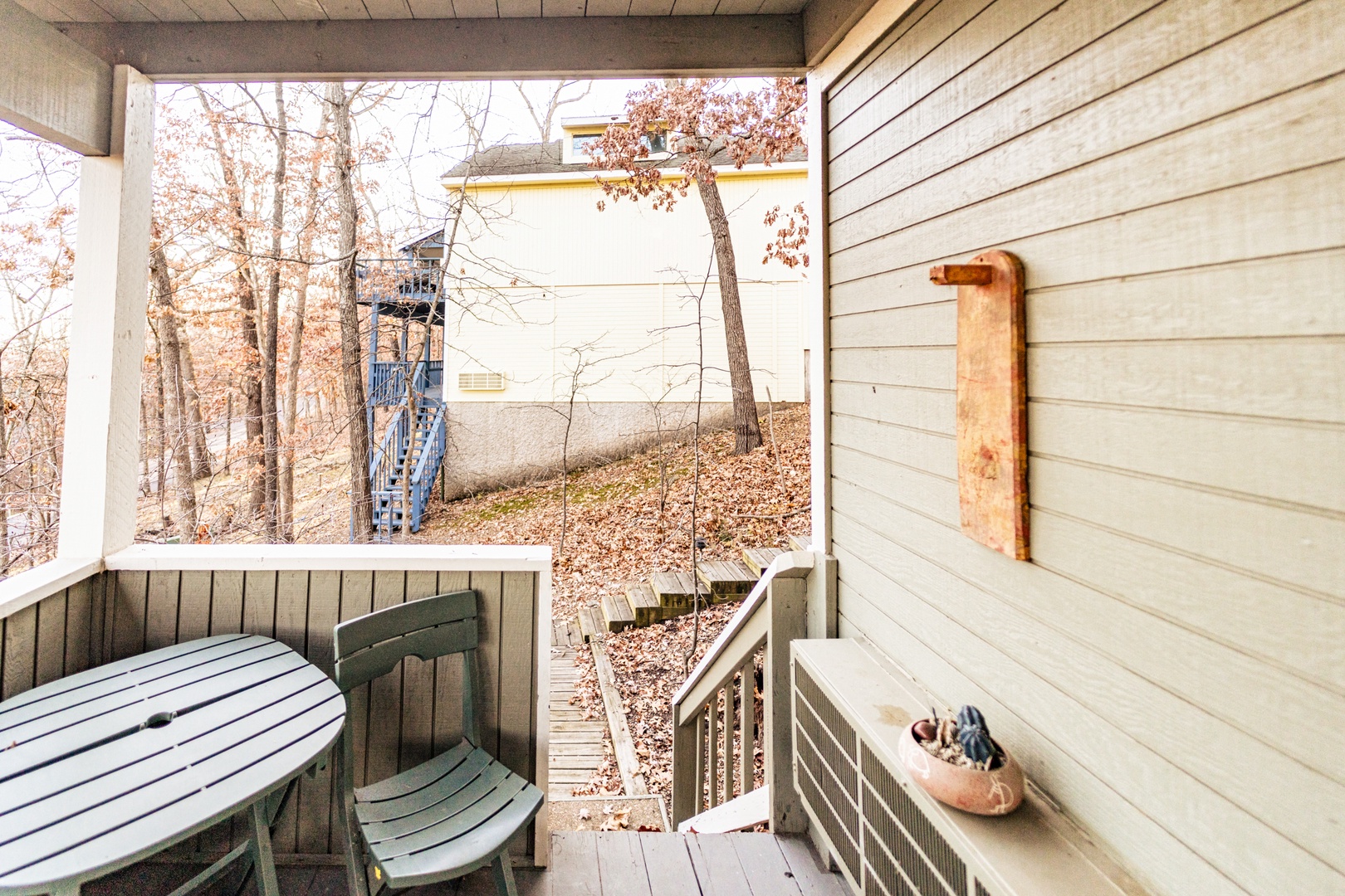 Relax & sway as you take in the view on the lower-level back deck