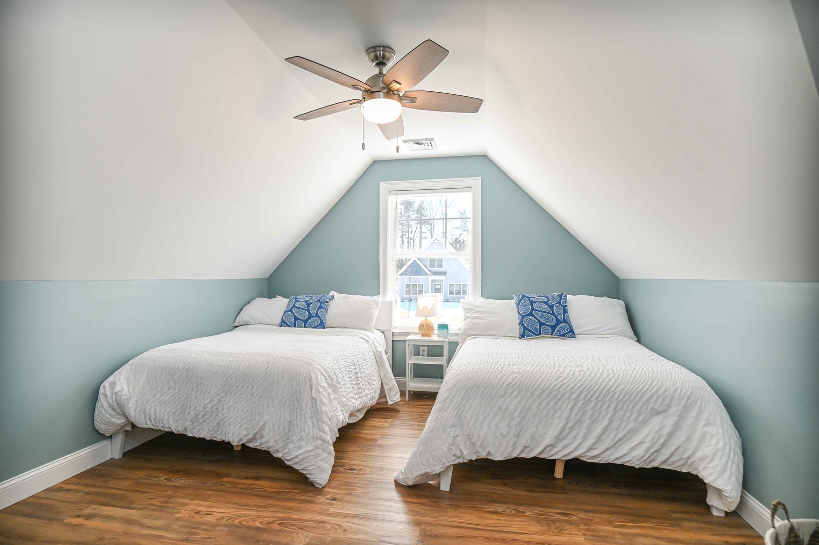 The final bedroom retreat includes a pair of full-sized beds & Smart TV
