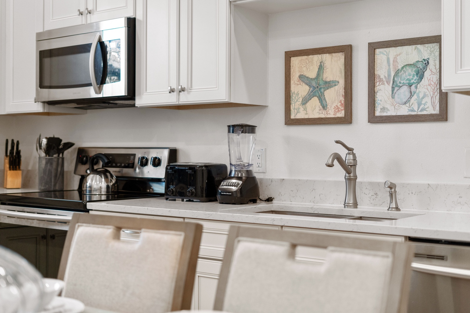 The beachy eat-in kitchen offers ample space & all the comforts of home