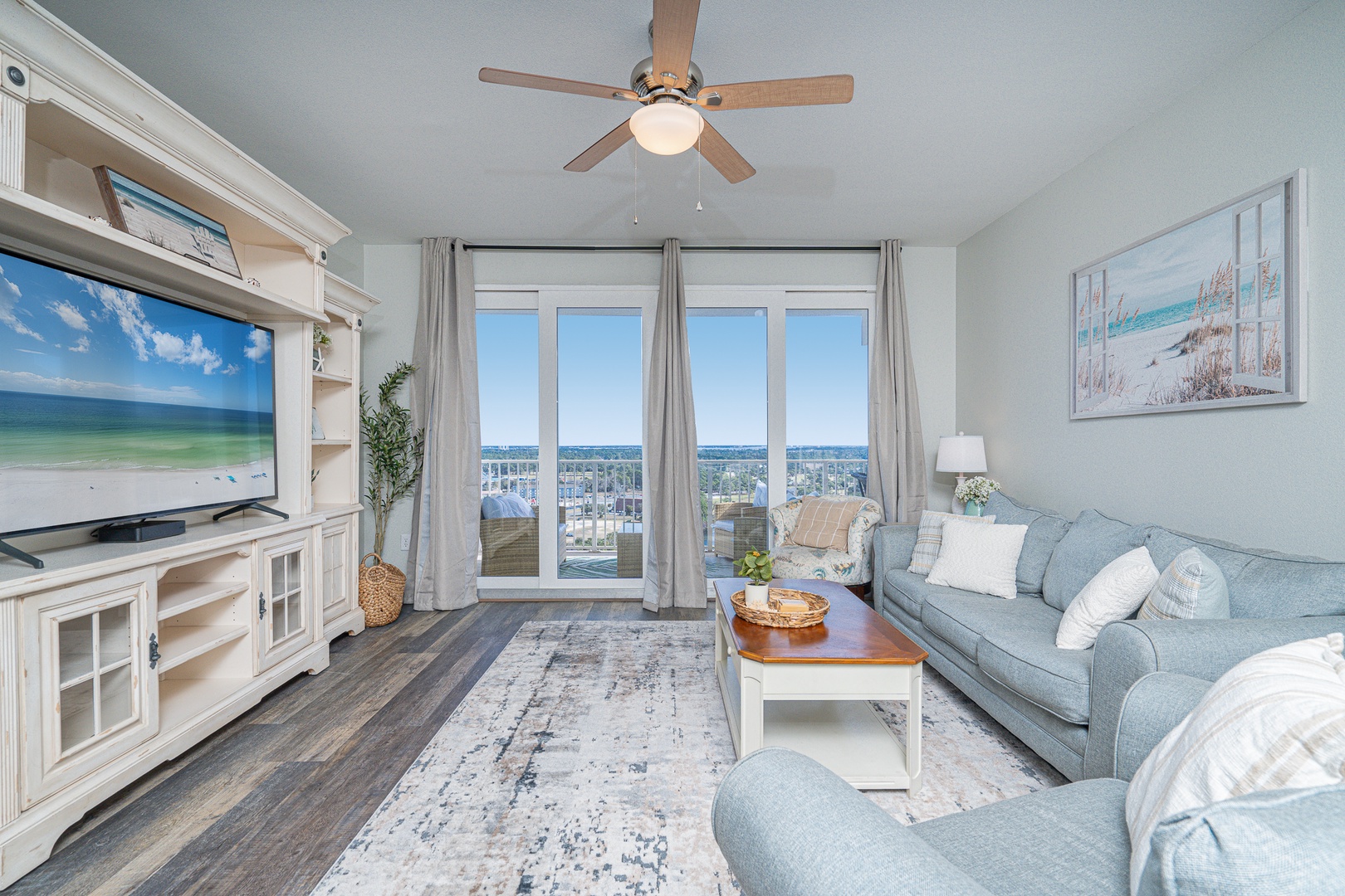 Coastal comfort awaits in the living room, with Smart TV & stunning views