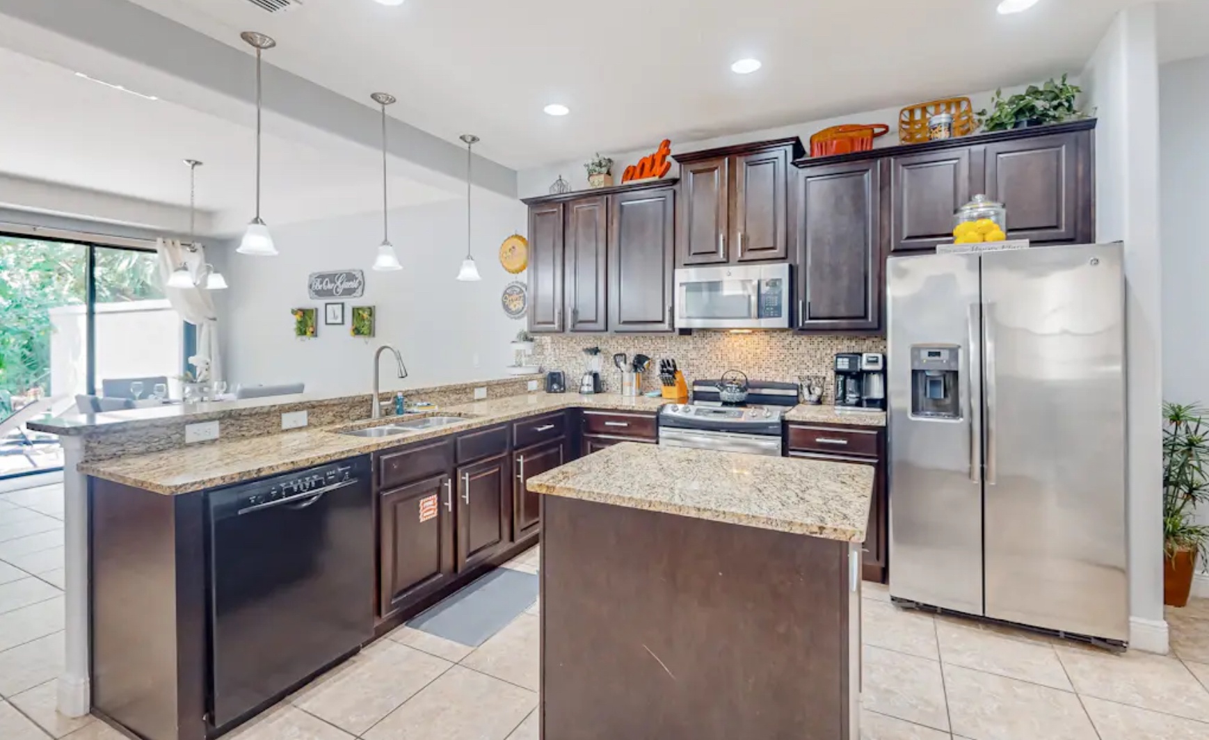 The open, airy kitchen offers ample space & all the comforts of home