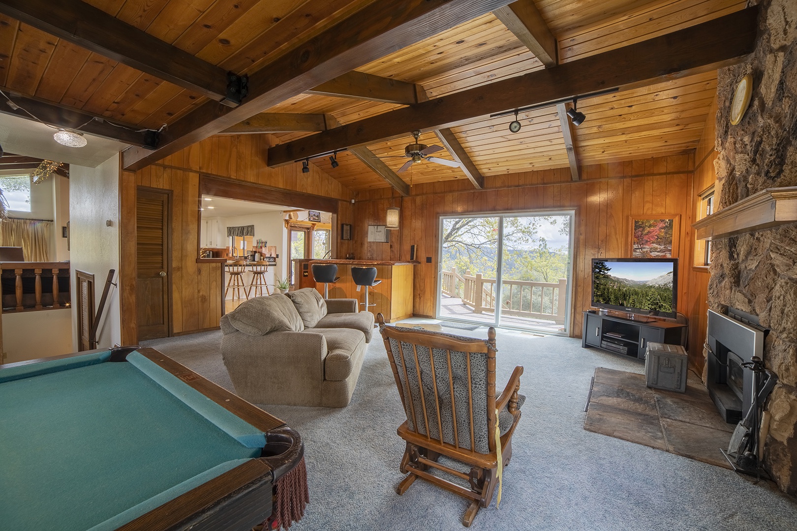 Game room with pool table, bar, seating area, and Smart TV