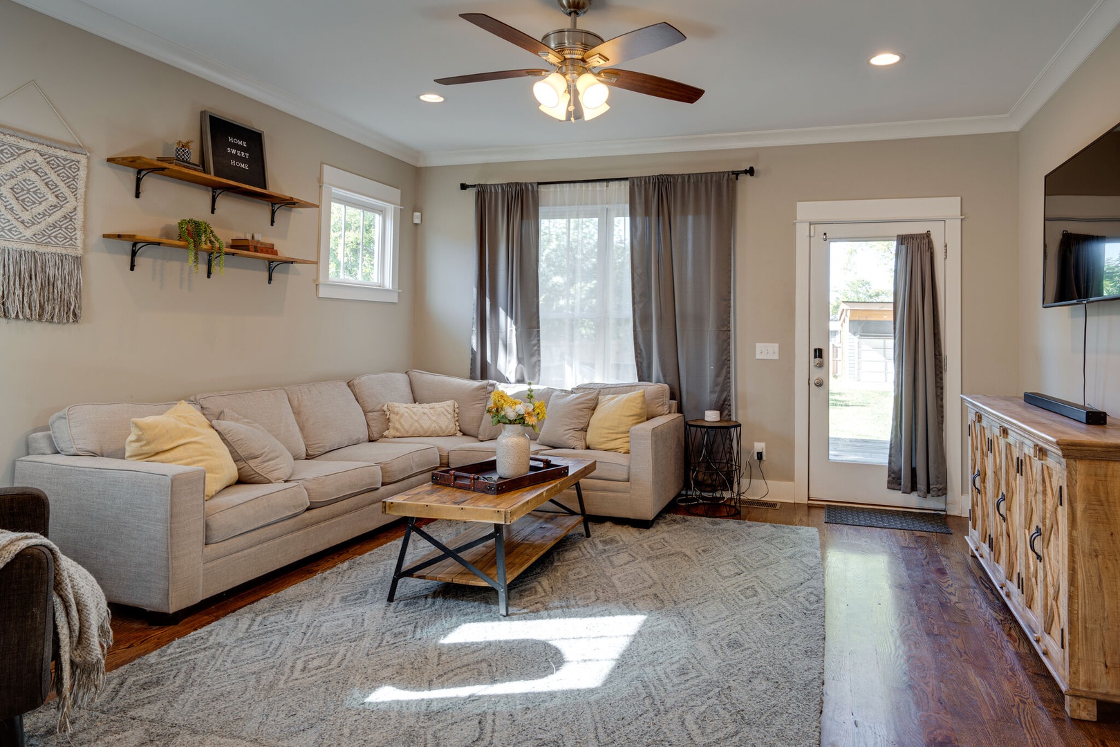 Ample seating space in the living room for a night of entertainment and relaxation