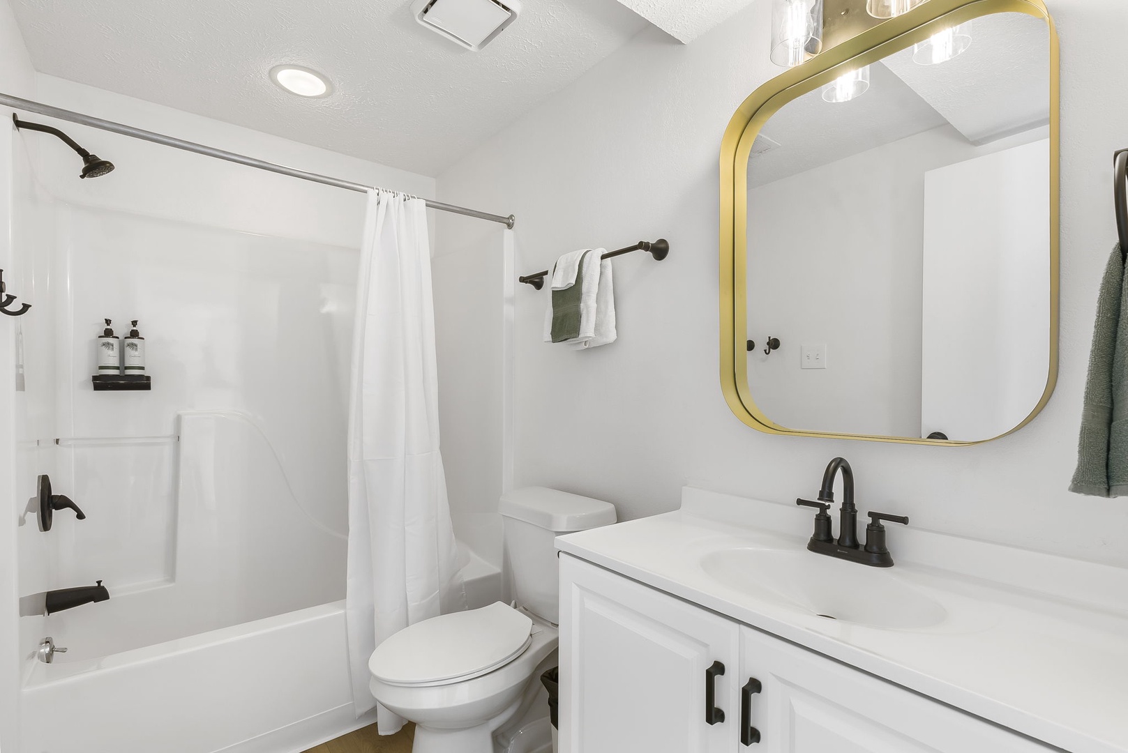 Unit 43: This 1st floor full bathroom includes a single vanity & shower/tub combo