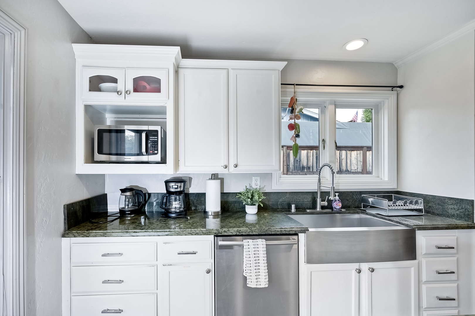 The open, modern kitchen offers ample space & all the comforts of home